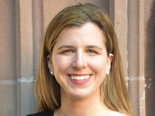 Headshot of a smiling woman with blonde hair