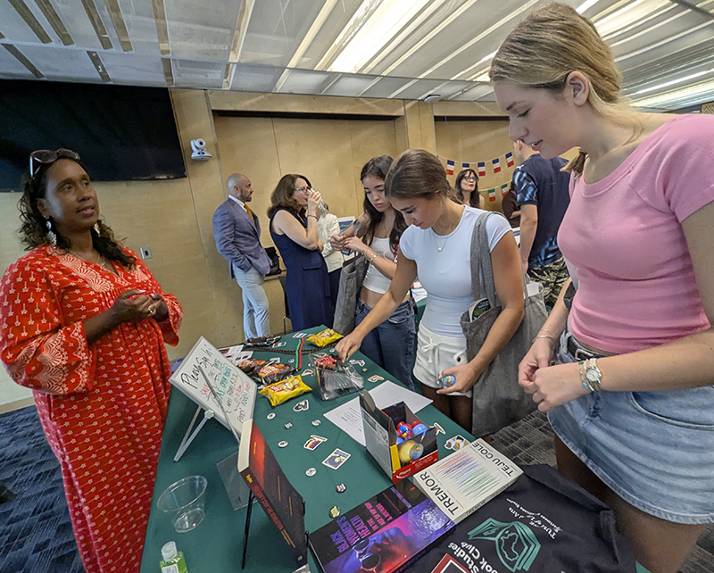 Africana Studies faculty member chats with students at Open House