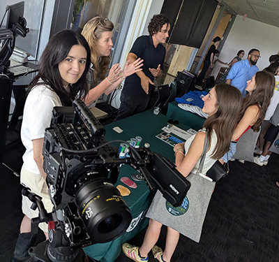 Digital Media Practices showcase one of their camera setups and chat with students at Open House