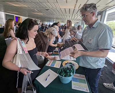 Theatre and Dance Faculty chat with Student at Open House