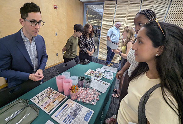 Jewish Studies faculty member chats with students at Open House