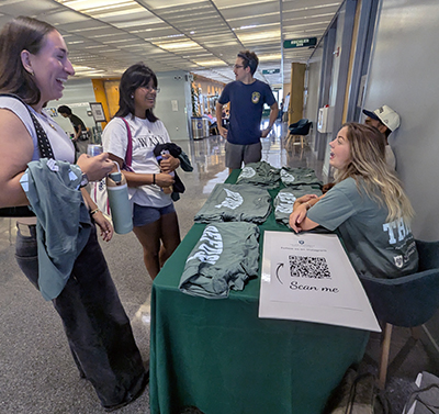 Students pick up tshirts at Open House