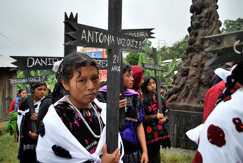 Procession in front of statue commemerating the 1997 Actel Massacre