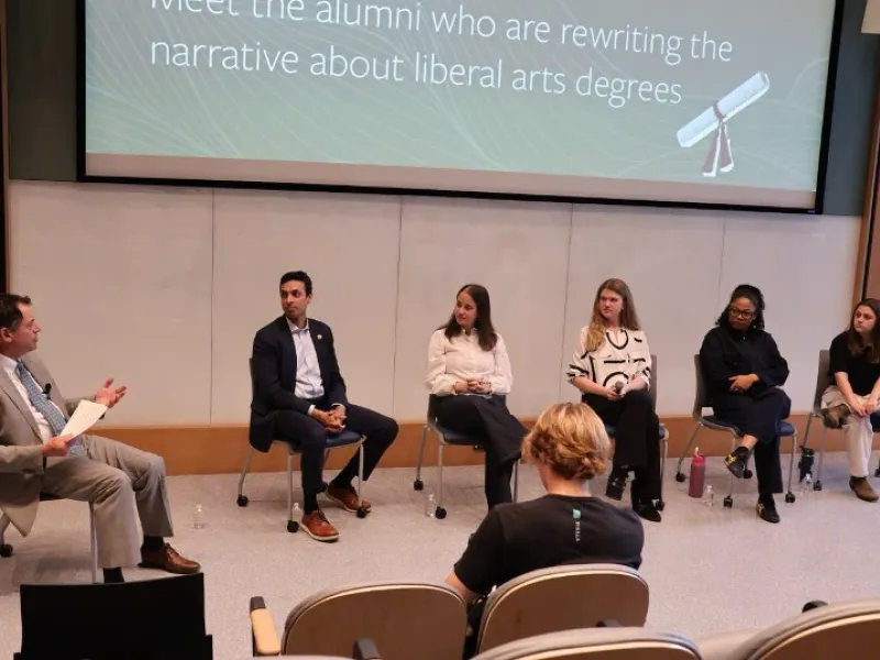 2026 Young Alumni Perspectives Panel moderated by Dean Edwards in Lake Village Theater.
