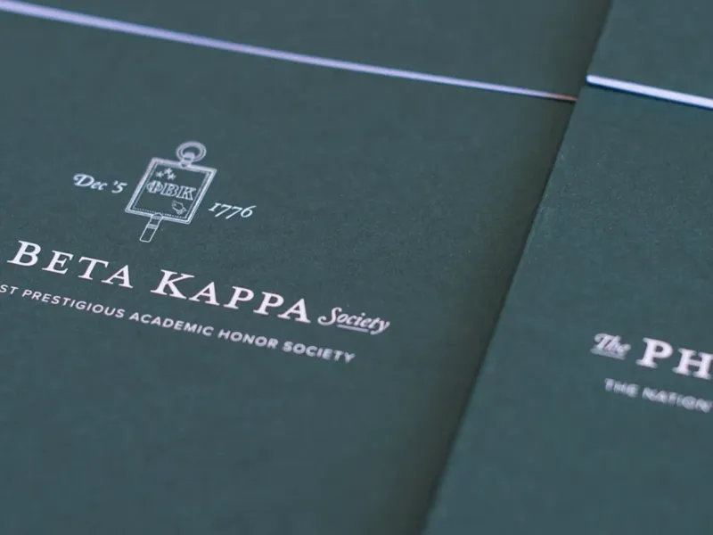 Dark green Phi Beta Kappa Society pamphlets with logo and text.