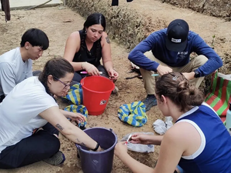 TIERA’s Archaeology team cleaning and sorting the artifacts we recovered. (Clockwise from bottom lef